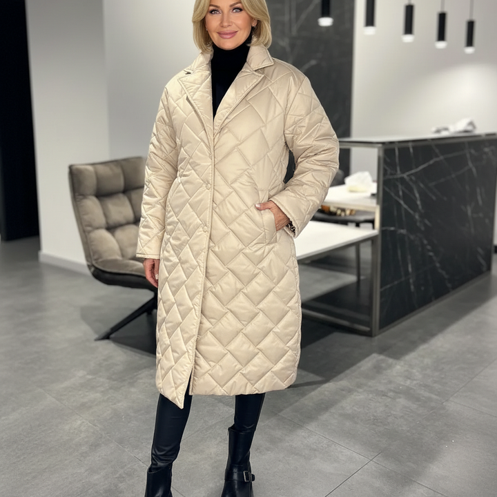 Black Livara™ quilted coat by Emma & Rose Cape Town, featuring a comfortable, padded design with a tailored fit.