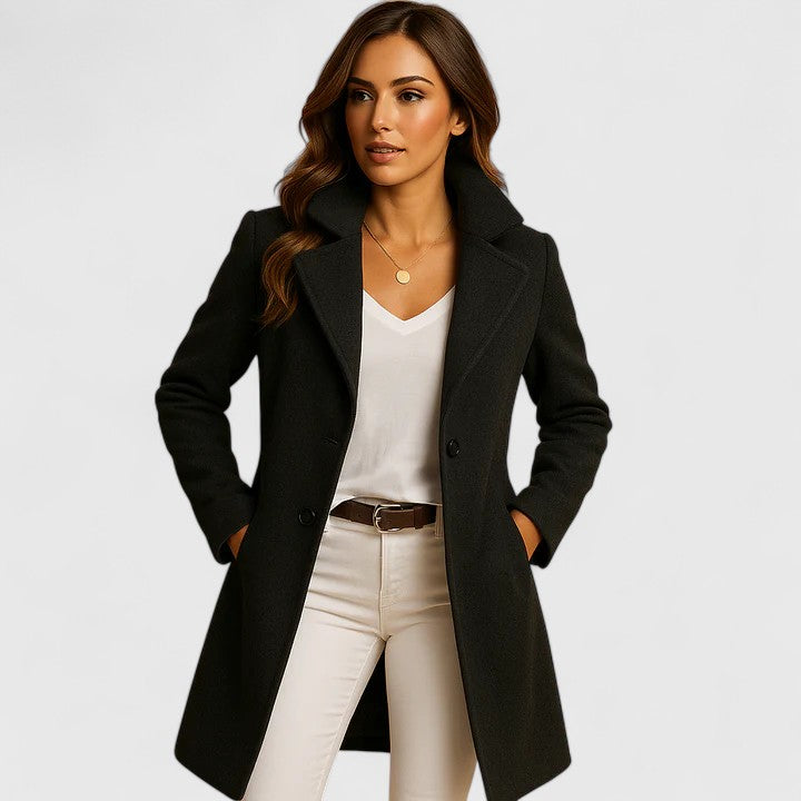 Black Rheya™ elegant coat by Emma & Rose Cape Town, featuring a tailored fit and sophisticated design, displayed on a hanger.