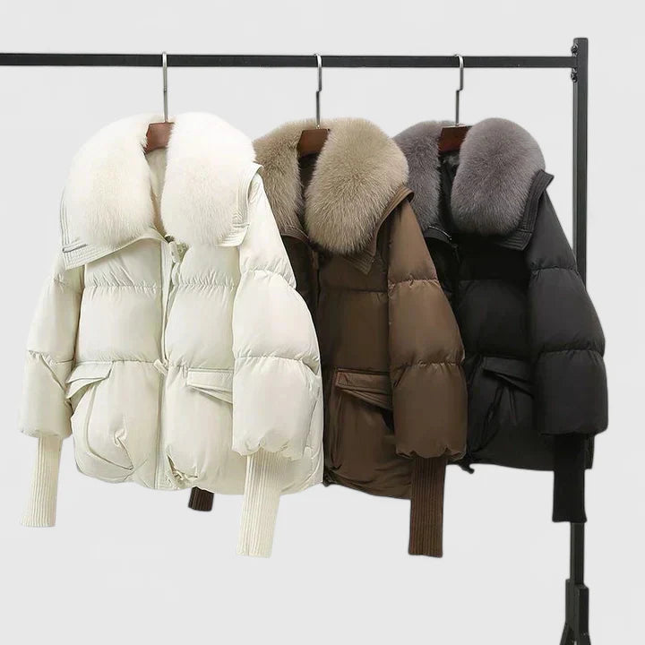 Black Zya™ comfortable jacket by Emma & Rose Cape Town, shown on a hanger with a relaxed fit and soft fabric.
