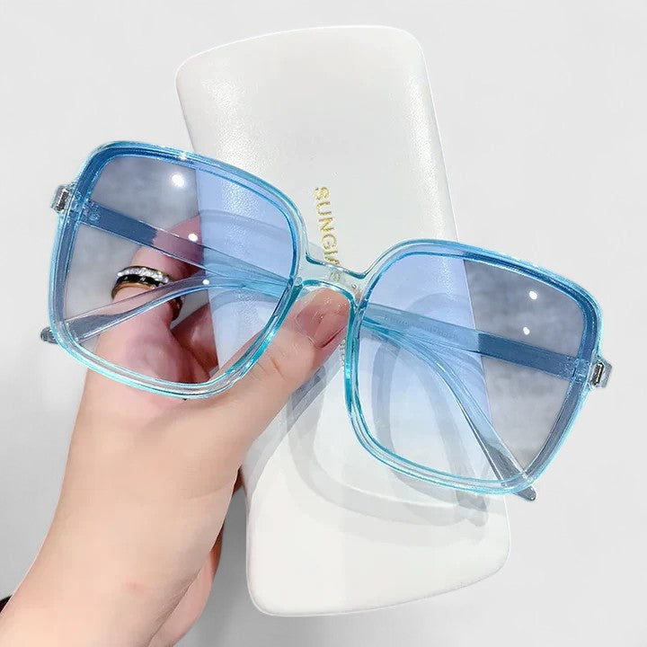 Emma & Rose Cape Town Destinie™ elegant sunglasses with blue tinted lenses and stylish frame, suitable for fashion and sun protection.