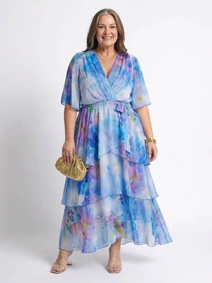 Emma & Rose Cape Town Calista™ Sheer Layered V Dress in blue, featuring a flowing, layered design and elegant V neckline.