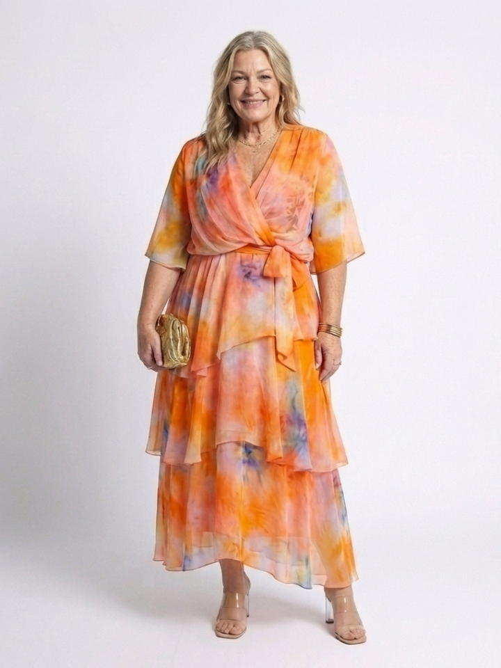 Emma & Rose Cape Town Calista Sheer Layered V Dress in blue, featuring a flowy, layered design with a V neckline.