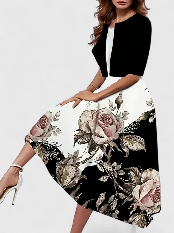 Emma & Rose Cape Town Chantal™ elegant midi dress in blue, showcasing a stylish, fitted design with a flowy hem.