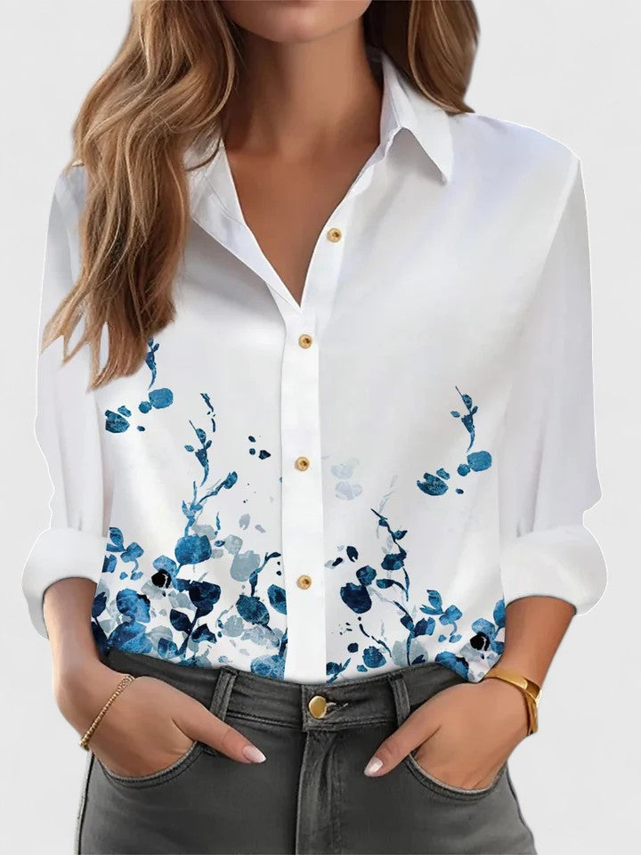 Emma & Rose Cape Town Margot™ elegant blue blouse with long sleeves and stylish design, displayed on a hanger.