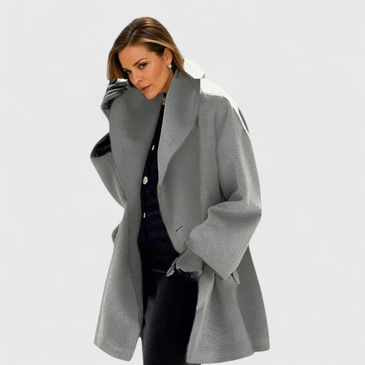 Emma & Rose Cape Town Oravienne™ elegant blue coat with tailored fit and stylish collar, displayed on a hanger.
