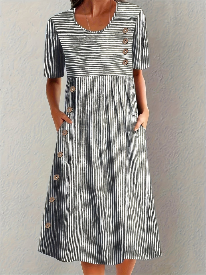 Emma & Rose Cape Town Sofia striped summer dress in blue, showing lightweight fabric and stylish design for warm weather.