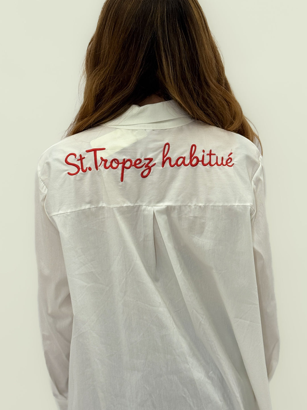 Light blue Rina long shirt by Emma & Rose Cape Town with intricate embroidery on the back, styled as a casual camicie.