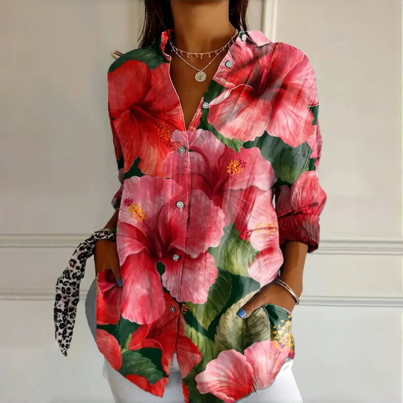 Multi-colored vintage floral print blouse by Emma & Rose Cape Town, featuring a classic chemisier style with elegant floral details.