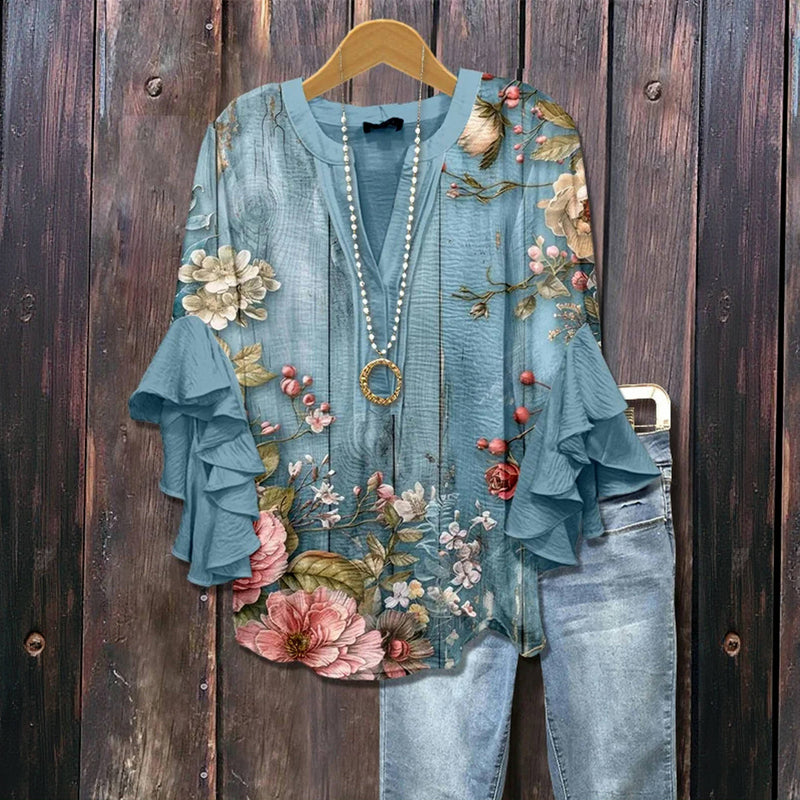 Multicolored vintage floral print blouse from Emma & Rose Cape Town, classic chemisiers style with vibrant design.