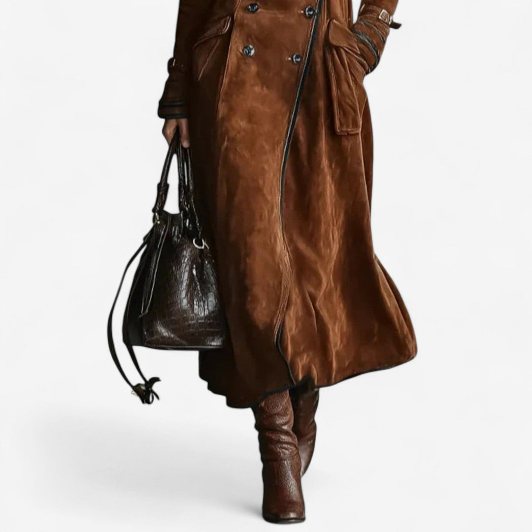 Dark brown Nathaly™ velvety trench coat by Emma & Rose Cape Town, shown on a model with classic collar and belted waist.