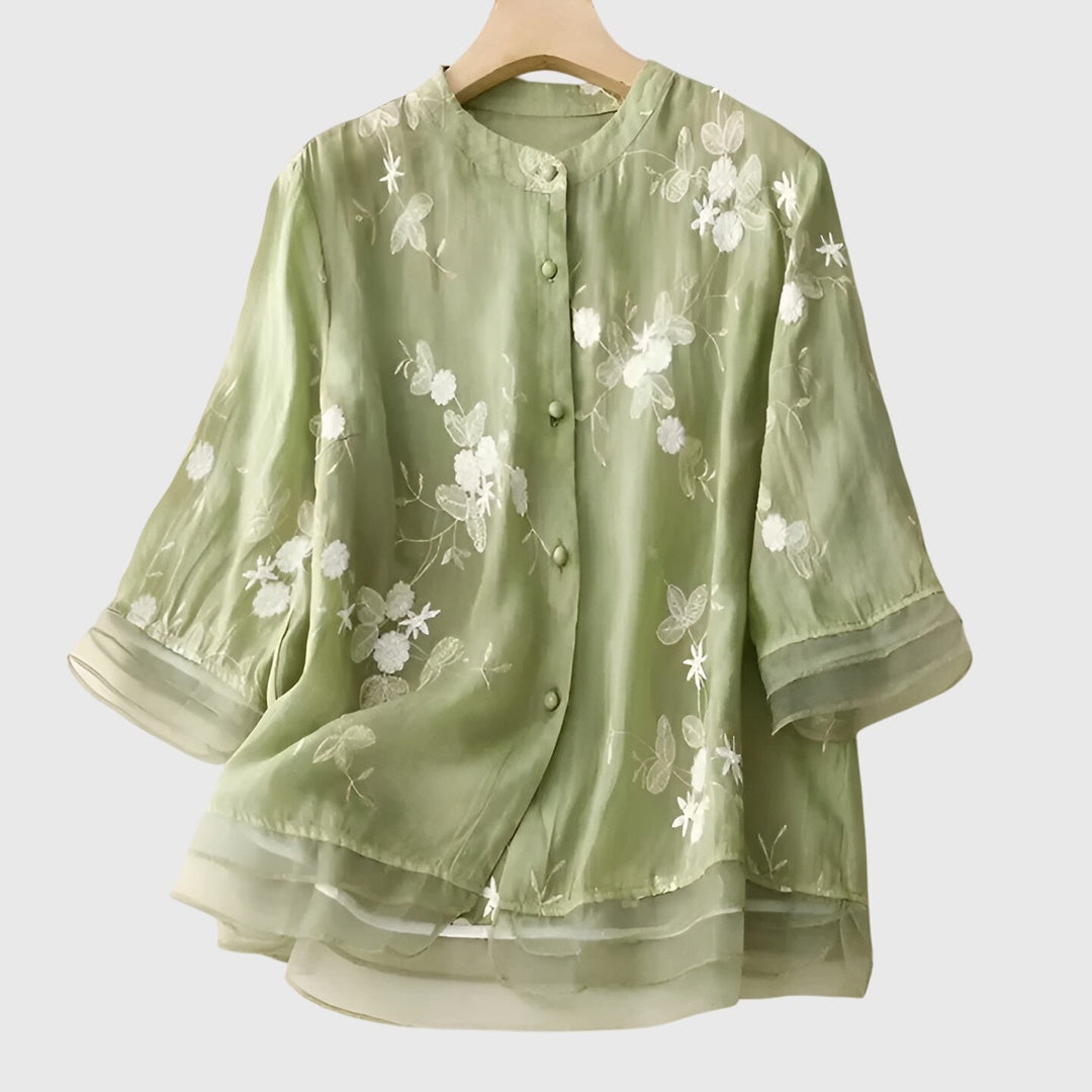 Cream Nellie™ elegant top by Emma & Rose Cape Town with embroidered floral details, showcasing a stylish, feminine design.