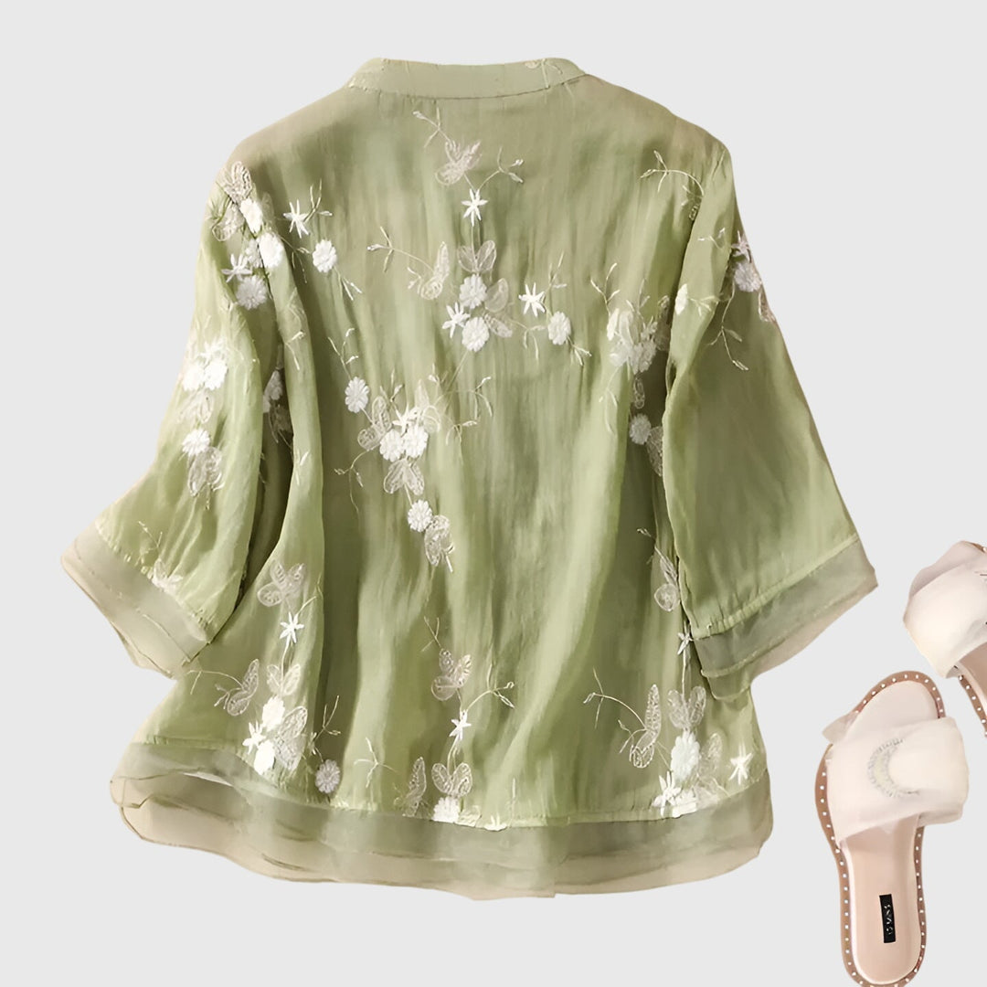 Emma & Rose Cape Town Nellie elegant top with embroidered floral design, cream color, and stylish neckline.