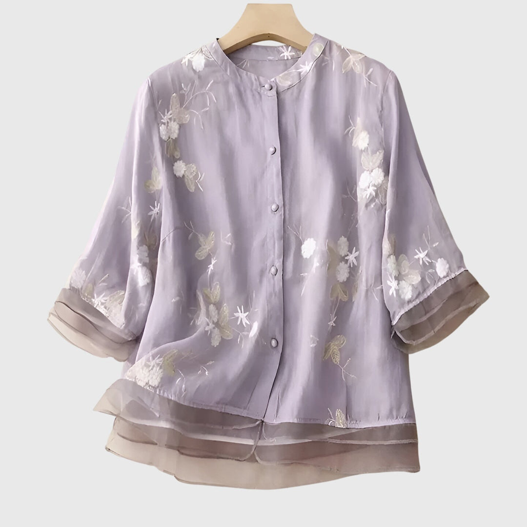 Cream Nellie™ elegant top with embroidered flowers by Emma & Rose Cape Town, showcasing detailed floral embroidery and stylish design.