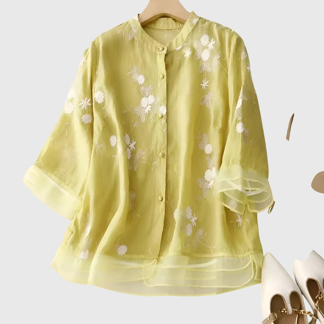 Cream Nellie™ elegant top with embroidered floral pattern from Emma & Rose Cape Town, showcasing detailed flower embroidery.