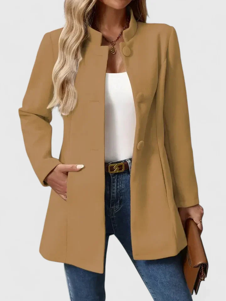 Cream Carmelyssa™ Elegant Jacket by Emma & Rose Cape Town, shown on a hanger with detailed fabric and stylish design.