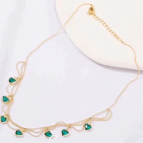 Heart Radiant Necklace by Emma & Rose Cape Town featuring a delicate gold chain and a sparkling heart pendant.