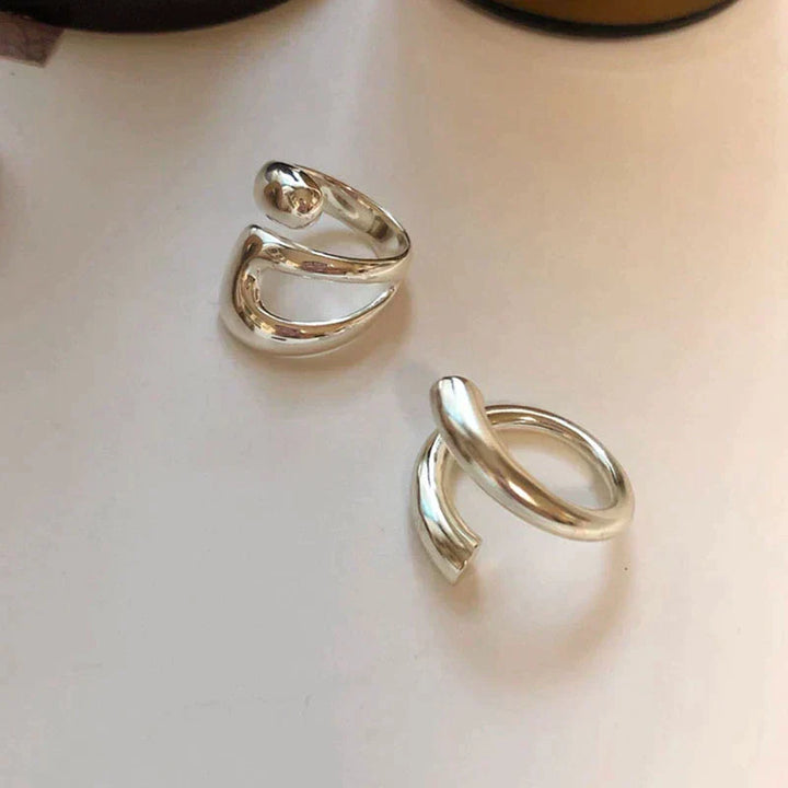 Emma & Rose Cape Town Vanessa™ elegant adjustable ring with intricate design, featuring a polished silver finish and delicate band.