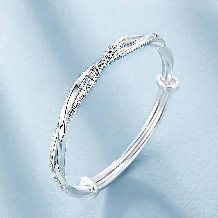 Ximena™ braided silver bracelet by Emma & Rose Cape Town, featuring intricate silver woven design on a delicate bracelet.
