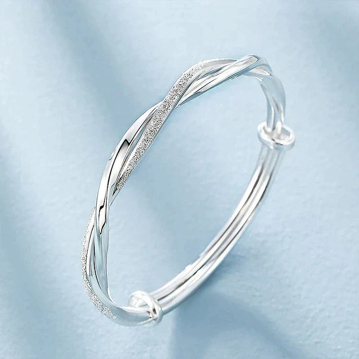 Ximena™ braided silver bracelet by Emma & Rose Cape Town, featuring intricate silver woven design on a delicate bracelet.