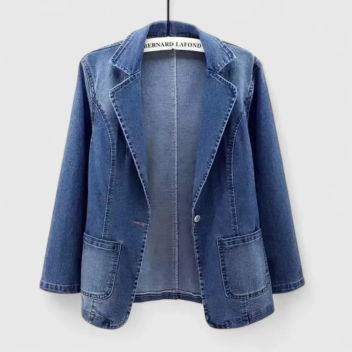 Emma & Rose Cape Town Rae™ elegant denim blue jacket displayed on a hanger with detailed stitching and classic design.
