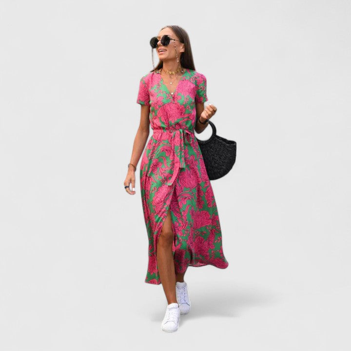 Pink Zinavell™ elegant midi dress for women by Emma & Rose Cape Town, shown on a mannequin with flowing fabric.