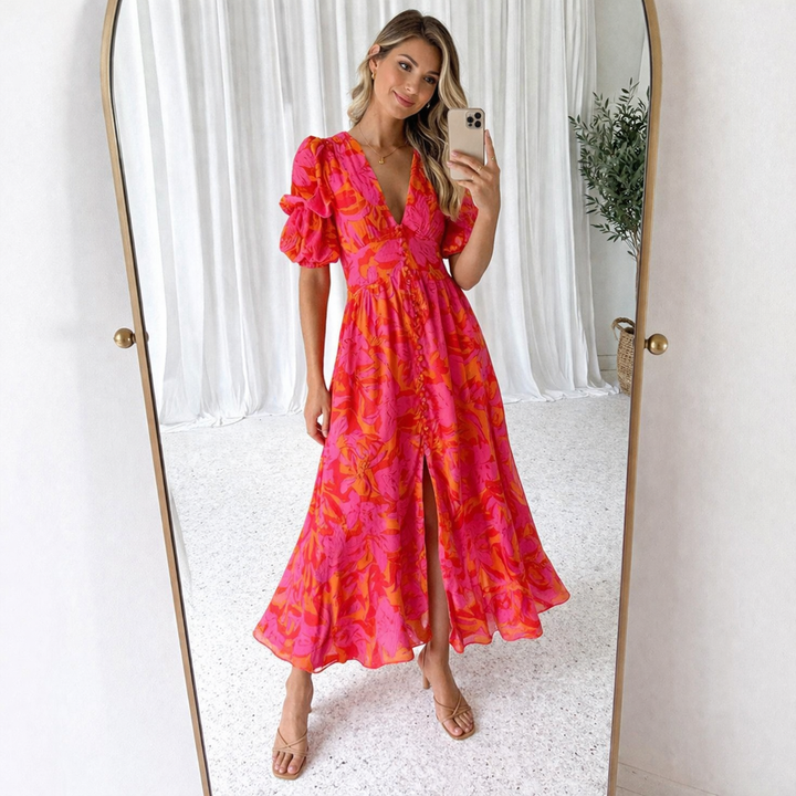 Pink VIVIENNE Paloma maxi dress with puff sleeves from Emma & Rose Cape Town, shown on a hanger.