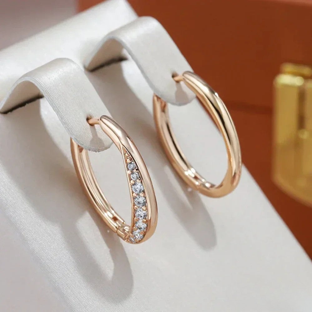 Elegant golden hoop earrings from Emma & Rose Cape Town, featuring a stylish and minimalist design.