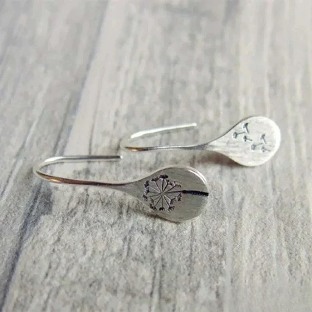 Elegant silver earrings from Emma & Rose Cape Town featuring a delicate and stylish design, perfect for sophisticated looks.