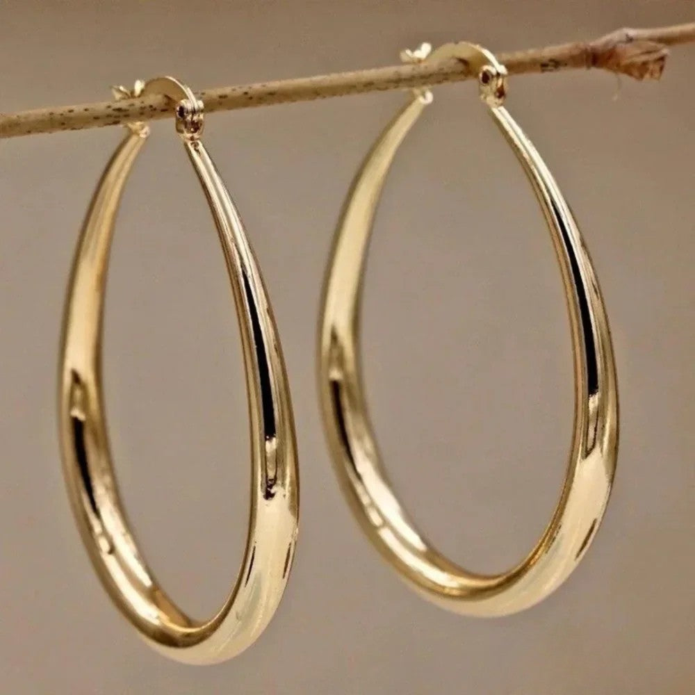 Retro™ hoop earrings by Emma & Rose Cape Town, gold-toned metal earrings with a classic hoop design, shown on a white background.