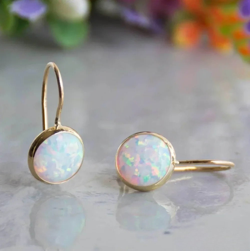 Retro™ Opalstein Gold Earrings by Emma & Rose Cape Town featuring elegant gold earrings with vibrant opal stone accents.