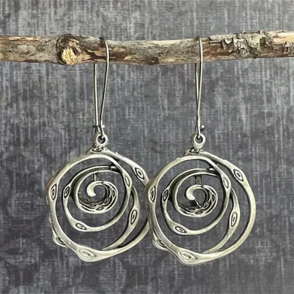 Retro™ silver earrings with labyrinth design by Emma & Rose Cape Town, featuring intricate geometric patterns and polished finish.