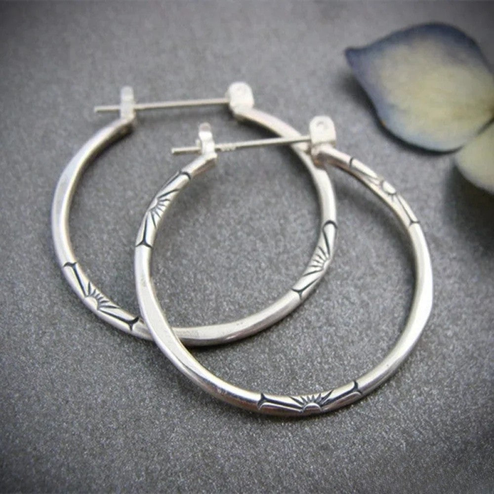 Retro™ silver hoop earrings by Emma & Rose Cape Town, stylish round earrings with a polished finish, perfect for everyday wear.