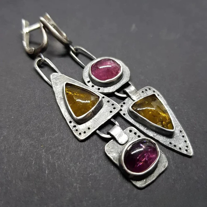 Retro™ triangular geometric earrings by Emma & Rose Cape Town featuring bold triangular shapes and modern design.