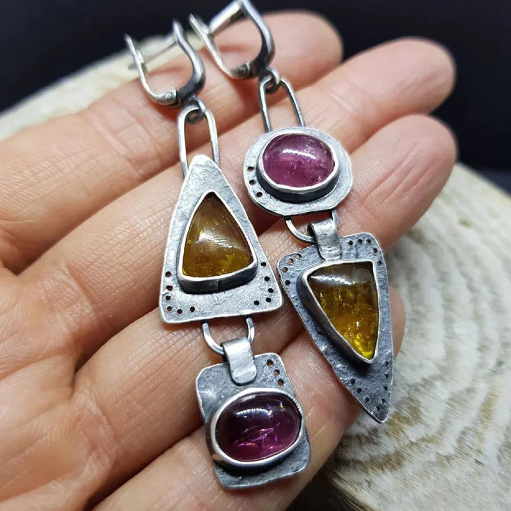 Retro™ triangular geometric earrings by Emma & Rose Cape Town featuring bold, modern triangle shapes in a stylish design.