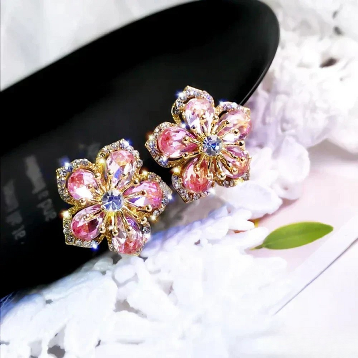 Sterling silver earrings by Emma & Rose Cape Town featuring colorful zirconia stones in a stylish earring design.
