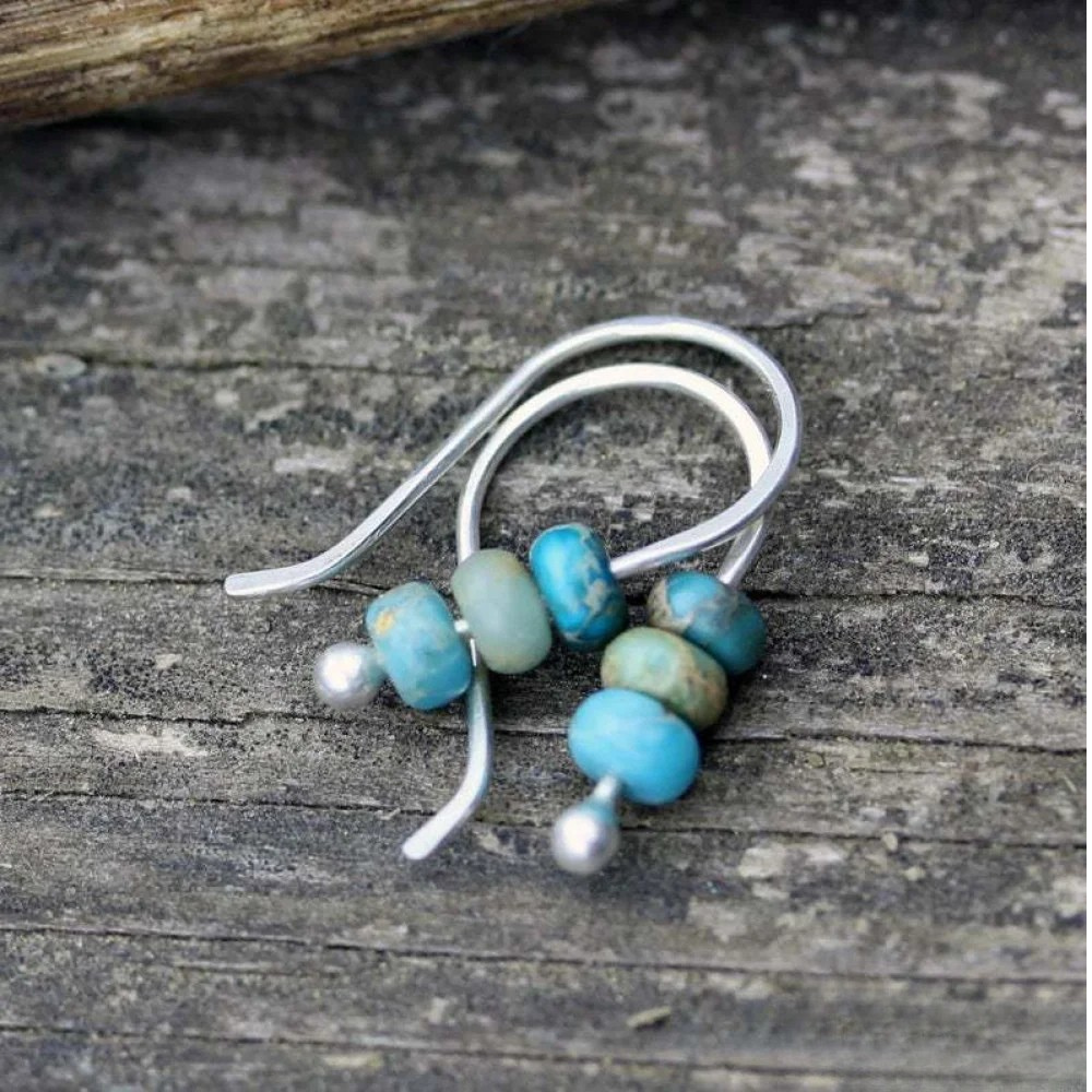 Turquoise and pearl earrings by Emma & Rose Cape Town, featuring elegant drop design with vibrant turquoise stones and lustrous pearls.