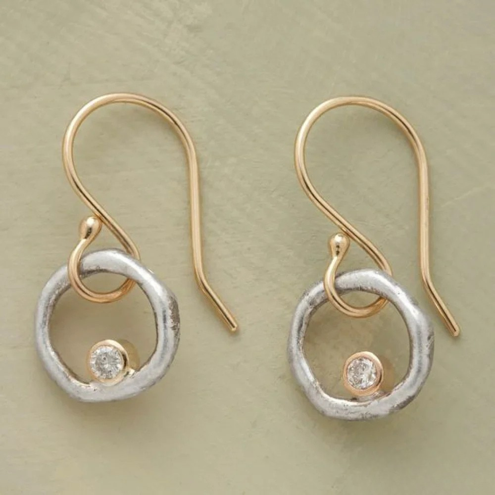 Vintage gold and silver earrings from Emma & Rose Cape Town, featuring elegant design and intricate detailing.