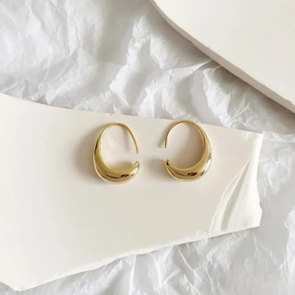 Gold Imke™ elegant earrings by Emma & Rose Cape Town featuring intricate design and polished finish.