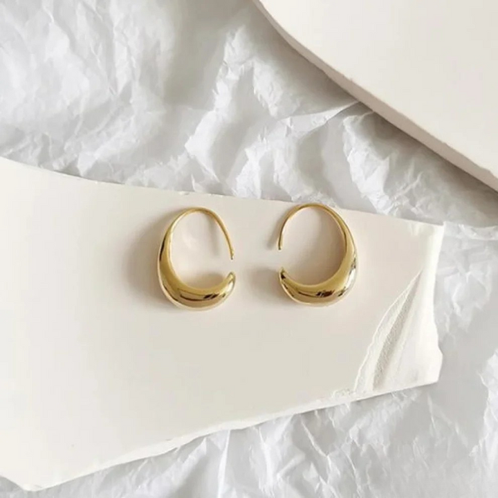 Gold Imke™ elegant earrings by Emma & Rose Cape Town featuring intricate design and polished finish.