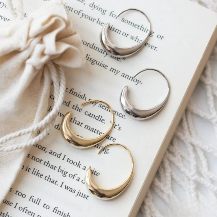 Emma & Rose Cape Town Imke™ elegant gold earrings with intricate design, showcasing their stylish and sophisticated look.