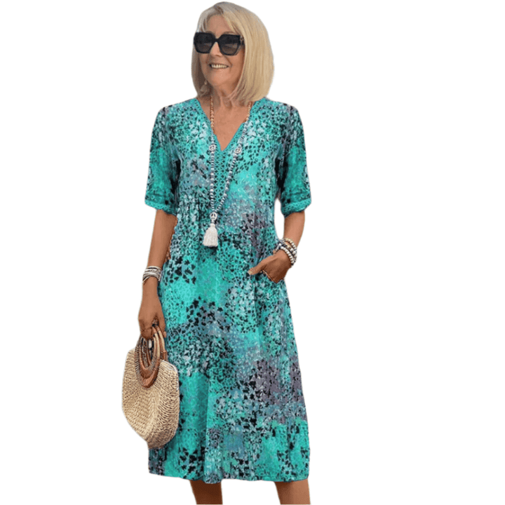 Beige Maeva™ casual V-neck dress by Emma & Rose Cape Town, featuring a relaxed fit and stylish neckline.