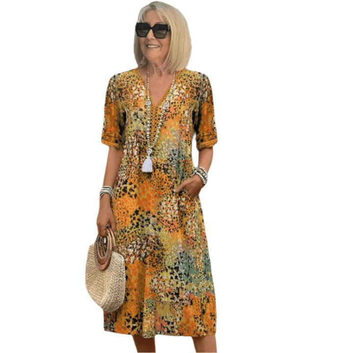 Beige Maeva™ casual V-neck dress by Emma & Rose Cape Town, lightweight fabric, relaxed fit, perfect for everyday wear.