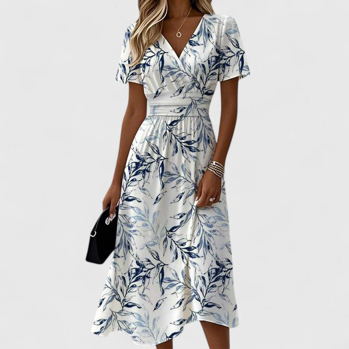 Emma & Rose Cape Town Fenyska elegant white floral dress, showcasing a stylish and feminine design with delicate floral patterns.