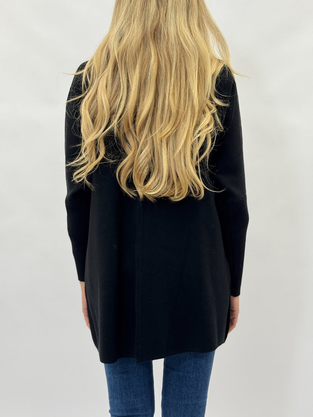 Black Daniëlle™ Long Knitted Cardigan by Emma & Rose Cape Town, shown as a stylish, cozy knit jacket.