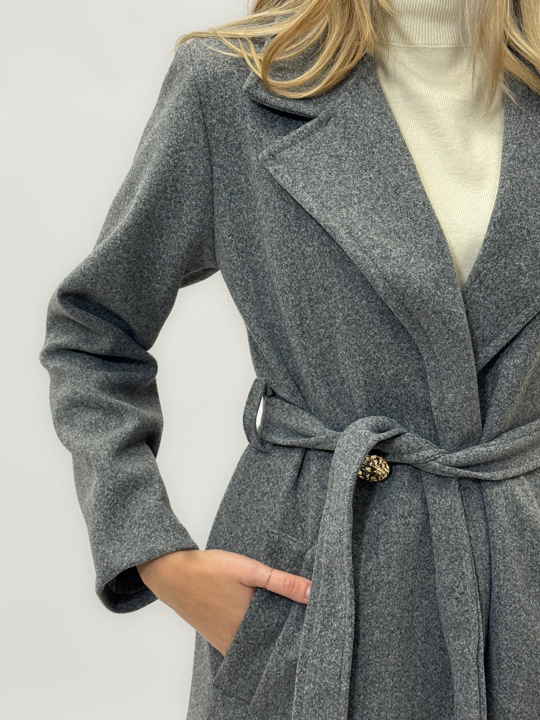 Black Fleur™ long coat by Emma & Rose Cape Town with a belt, designed for warmth and stylish winter wear.