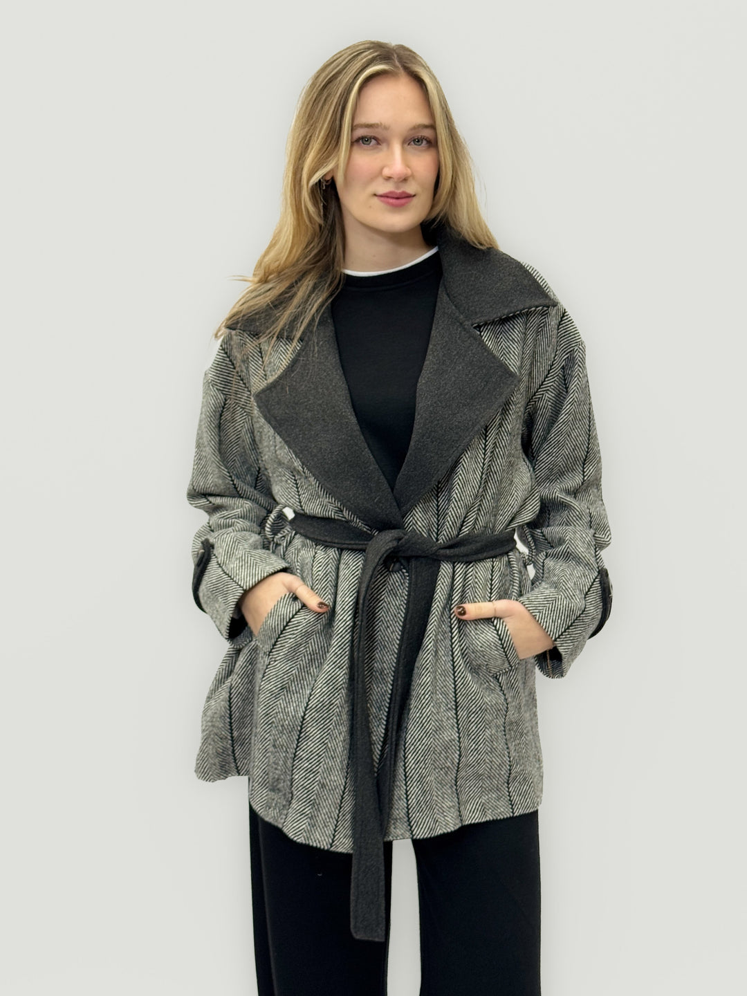 Black Rozanne patterned coat by Emma & Rose Cape Town with belt and lapel details, stylish and elegant outerwear.
