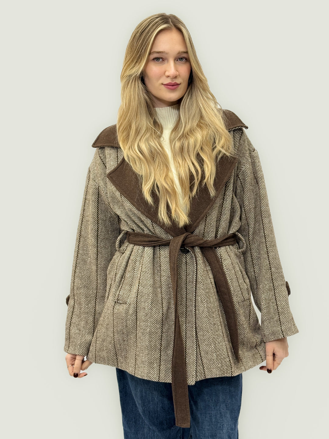 Black Rozanne patterned coat by Emma & Rose Cape Town featuring belt and lapel details, stylish and elegant outerwear.