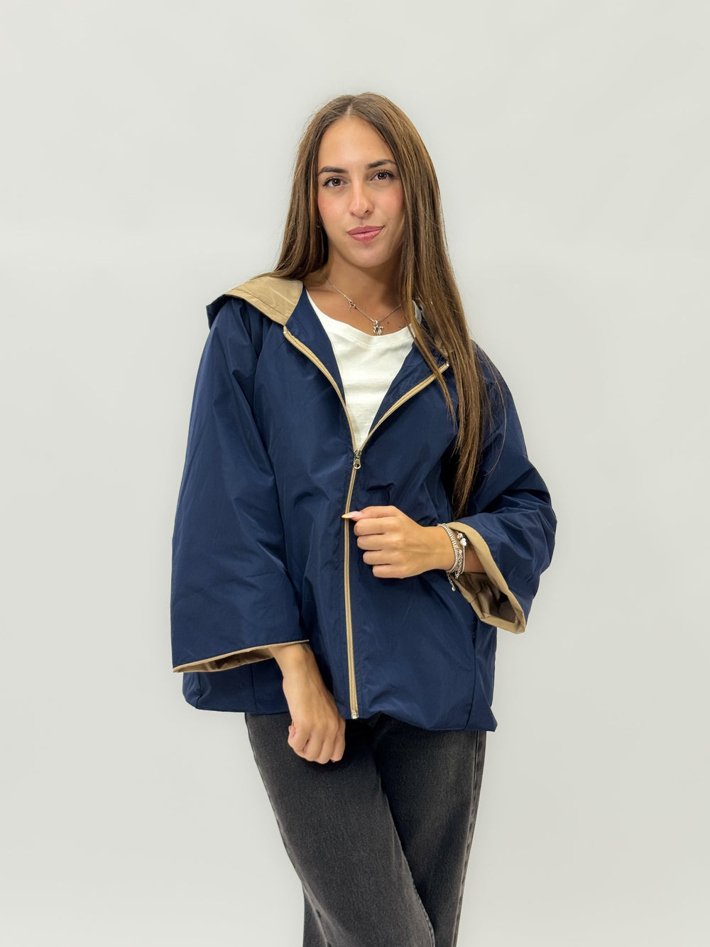Winnie™ hooded jacket by Emma & Rose Cape Town in beige with black exterior and cozy beige lining, stylish and warm.