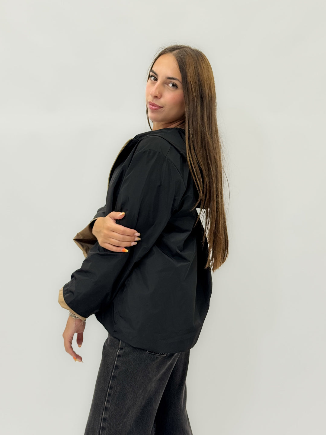 Winnie™ hooded jacket by Emma & Rose Cape Town with beige lining, black exterior, and a cozy, stylish design.