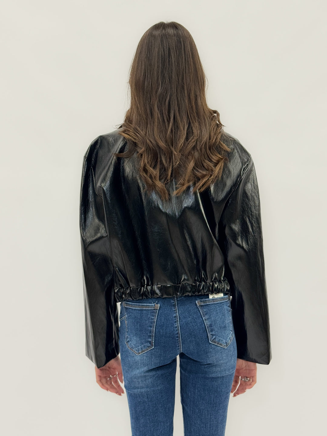 Tamsin™ black patent giacca by Emma & Rose Cape Town featuring soft luxurious fabrics and a front zipper.
